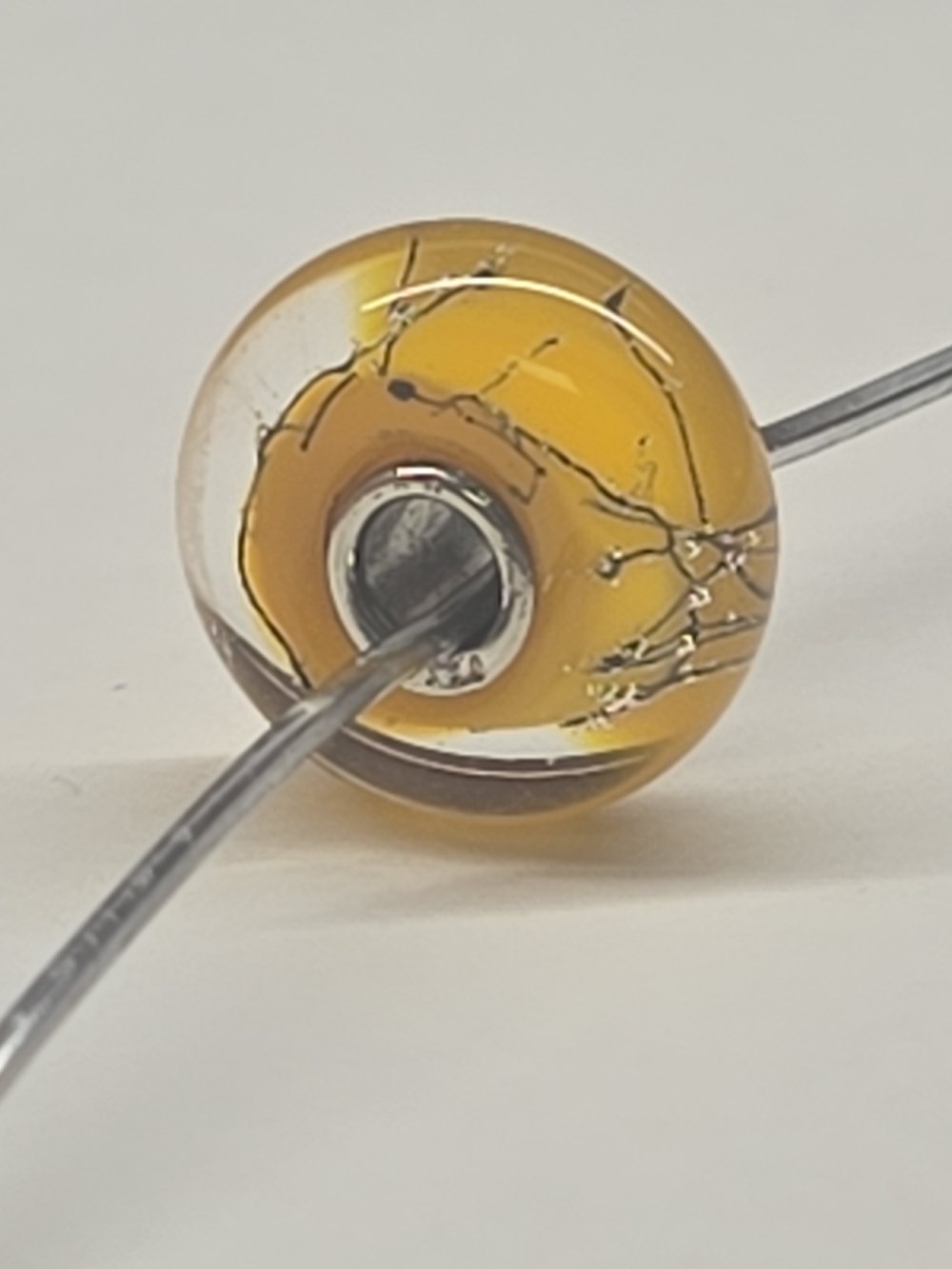 Orange Steel Glass Trollbead. TGLBE-10234 by Lise Aagaard. Retired In 2012.